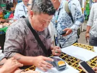 Pedagang Pasar Horas Mulai Bayar Retribusi Pakai QRIS